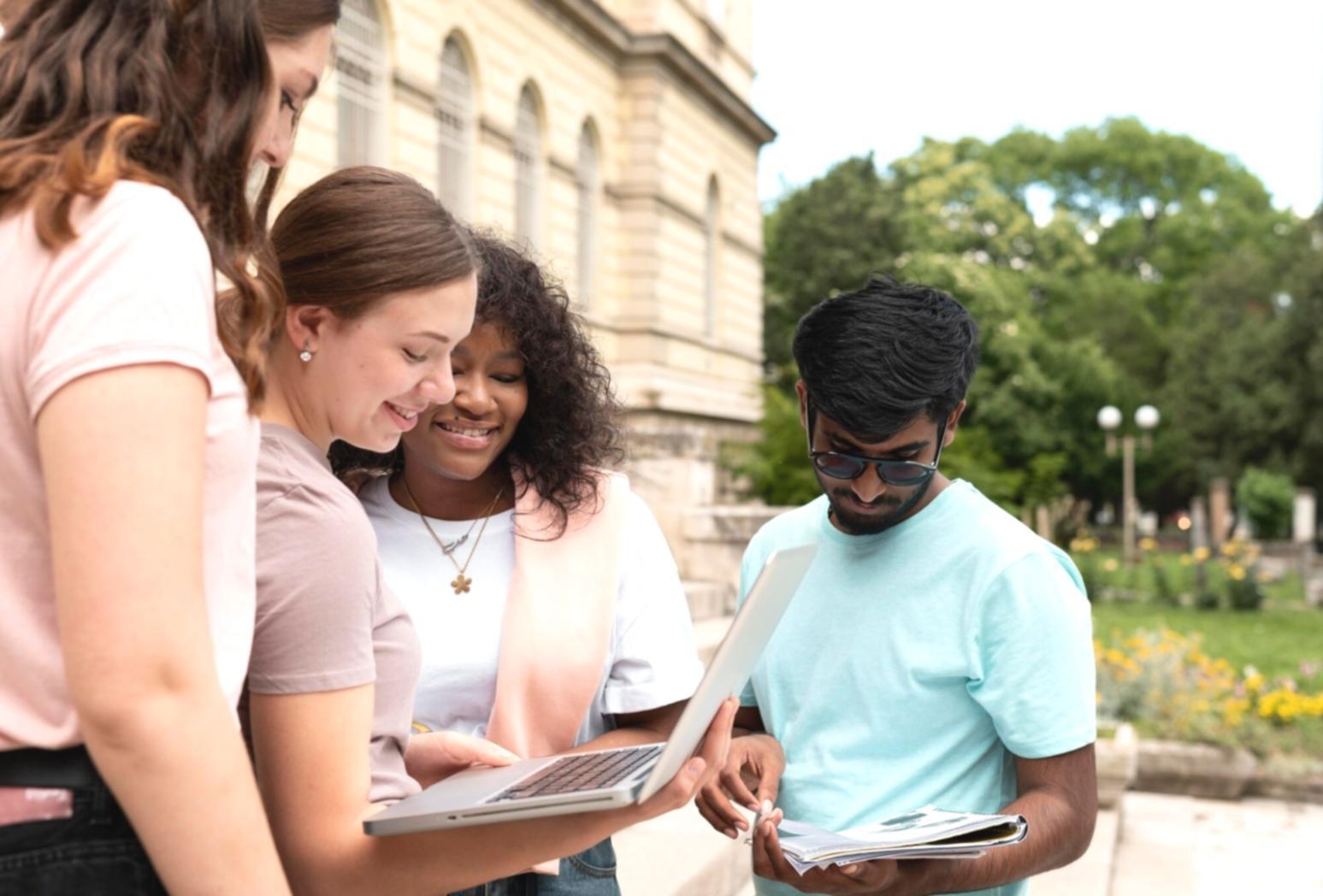 Students working together on financial analysis projects in collaborative learning environment